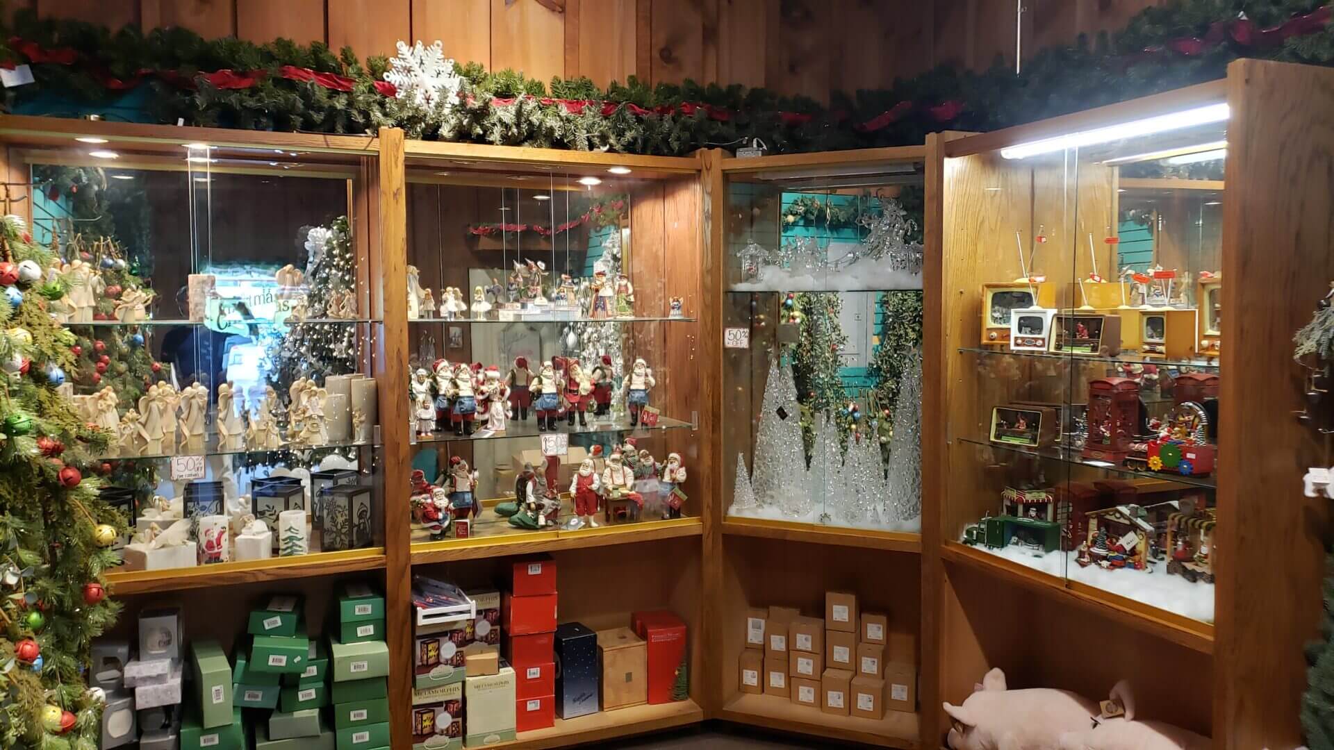 Cozy wooden shelves filled with Christmas decorations and gifts.